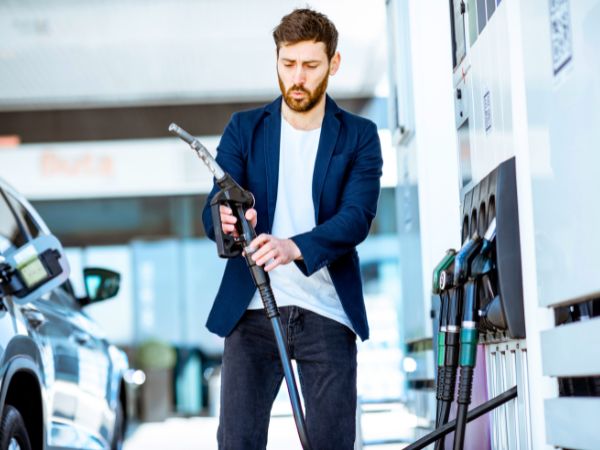 Man refuelling his rental car